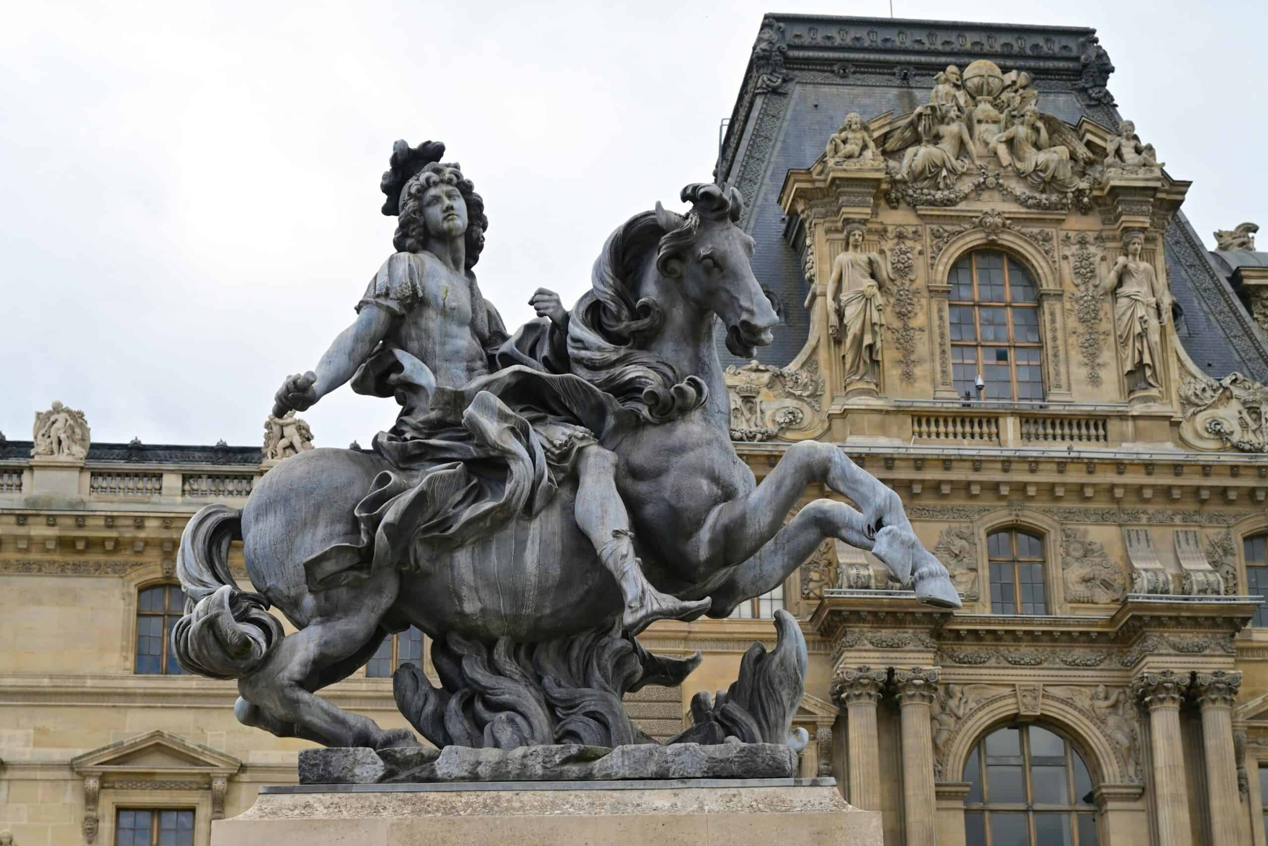 Louvre Museum Paris sculpture and historic palace facade
