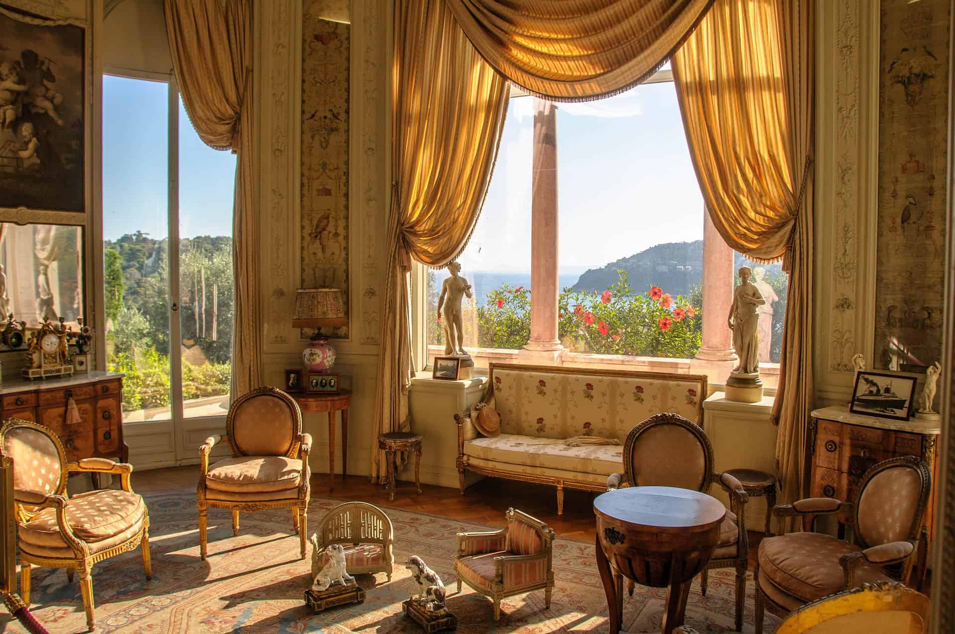 Villa Ephrussi de Rothschild interior salon with golden curtains and Mediterranean view Saint Jean Cap Ferrat