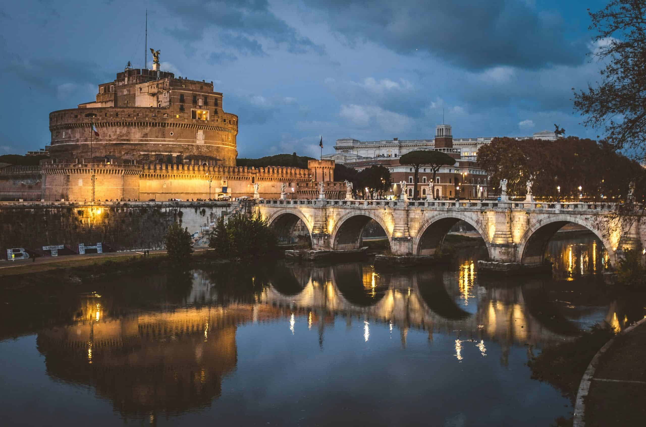 Castel Sant’Angelo Rome night view with illuminated bridge reflection on the Tiber River