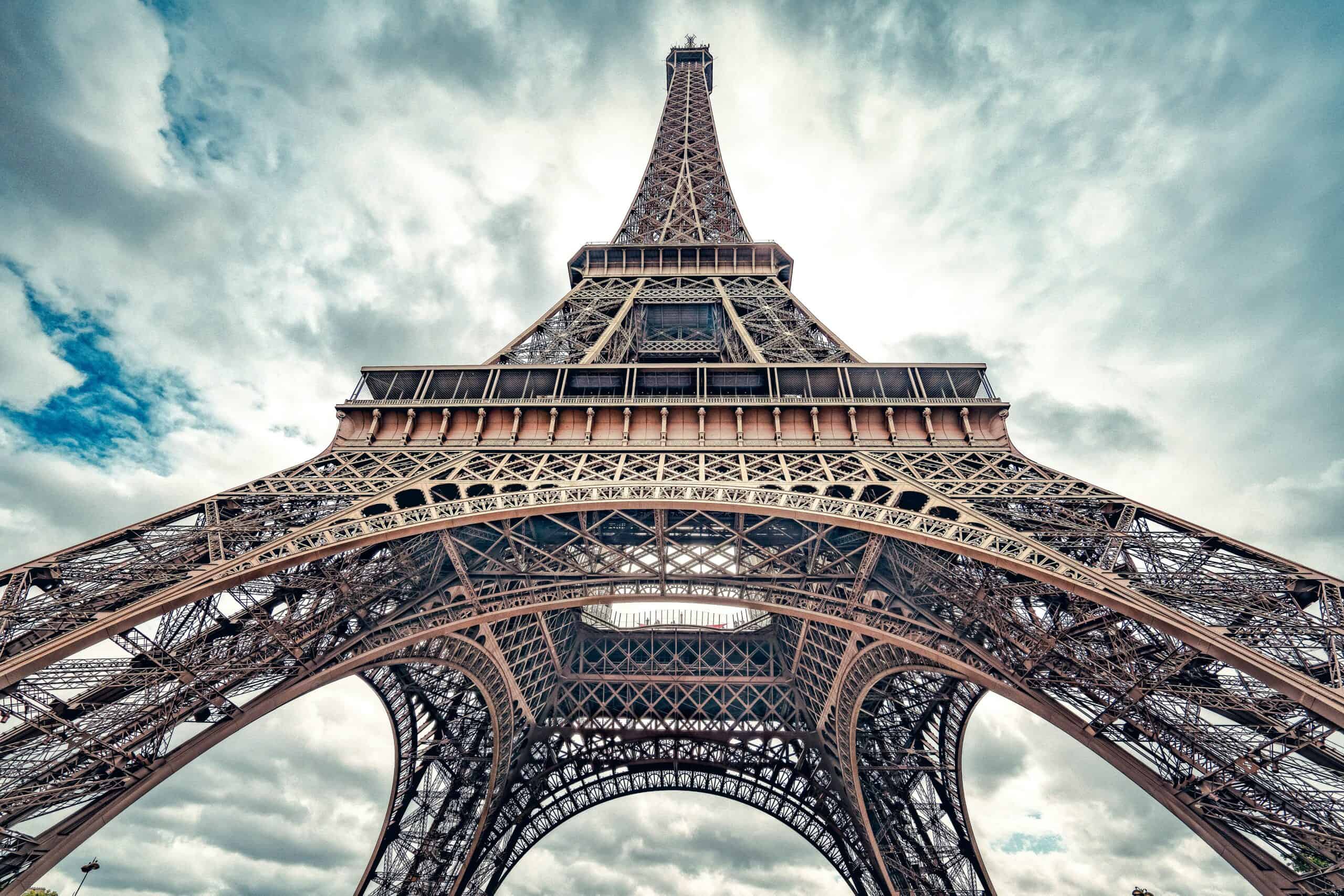 Eiffel Tower Paris viewed from below through its iron lattice structure