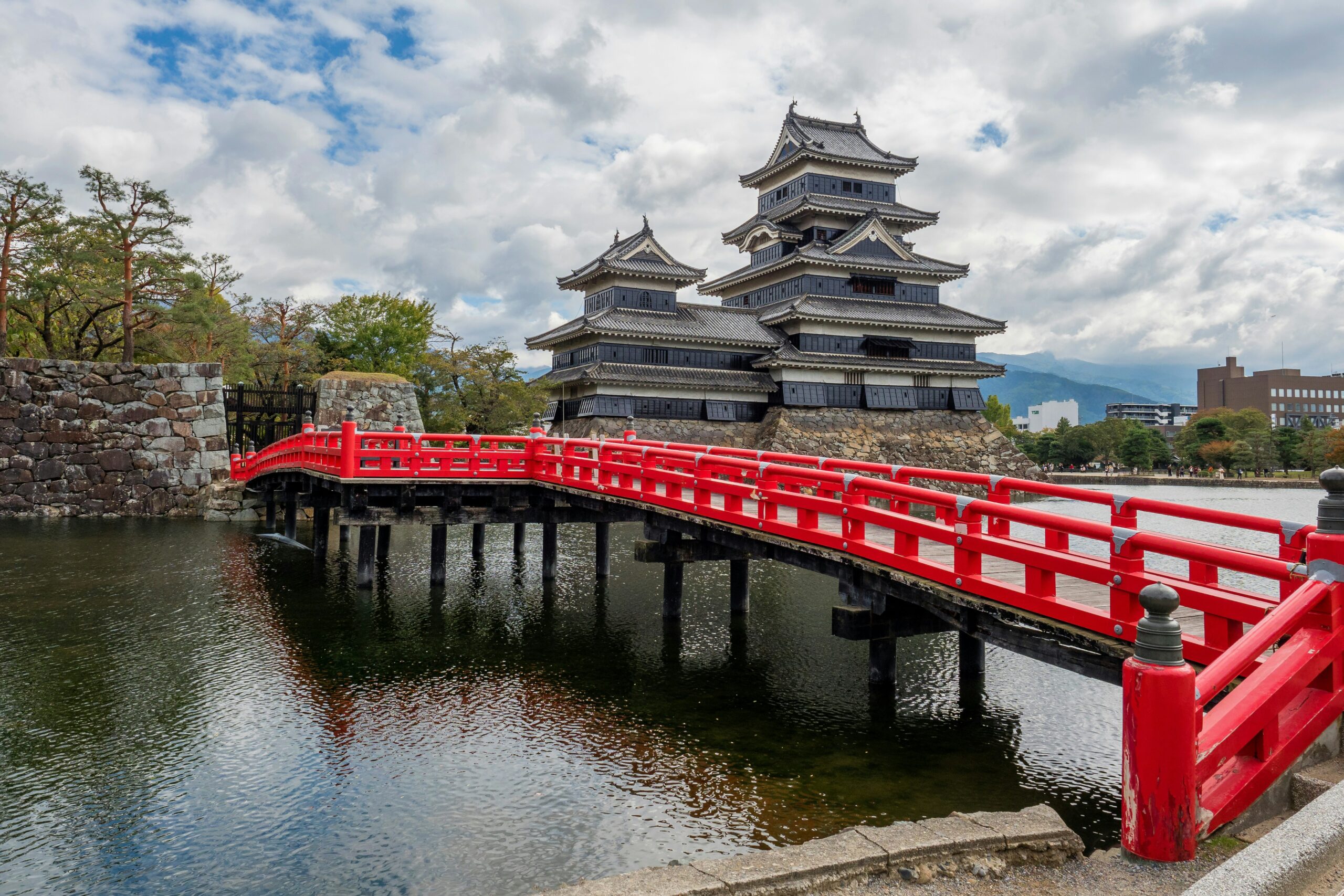 Matsumoto Castle with the red bridge and moat in Matsumoto, Nagano, Japan