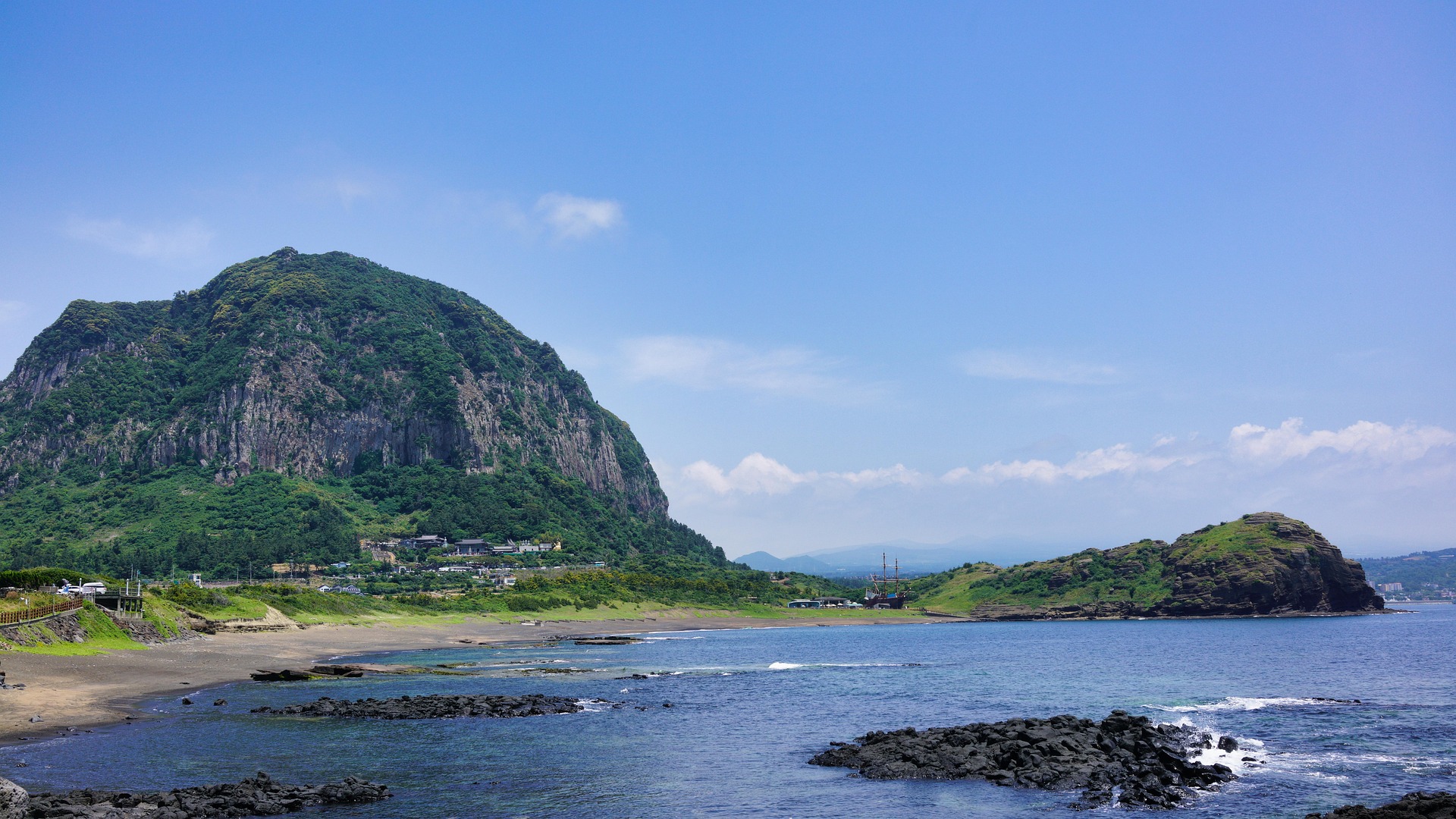 Sanbangsan Area in Seogwipo coastal volcanic dome with beach and lava rocks Jeju Island
