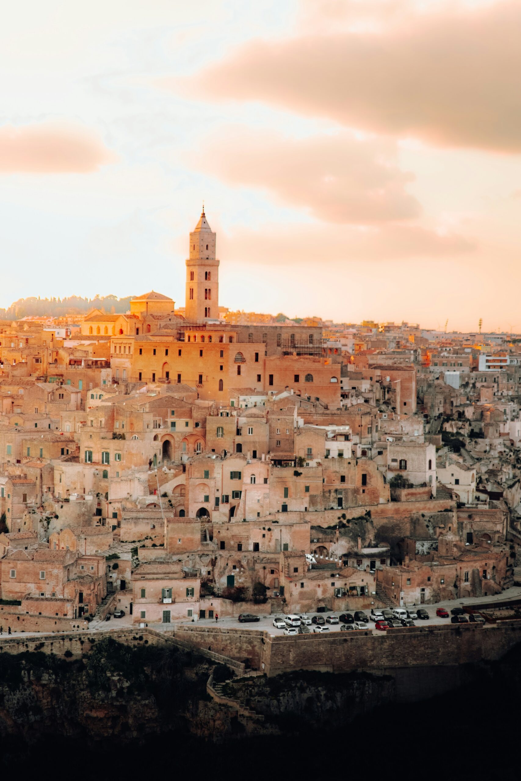 Matera Sassi cave city at sunset with historic stone buildings and cathedral view in Italy