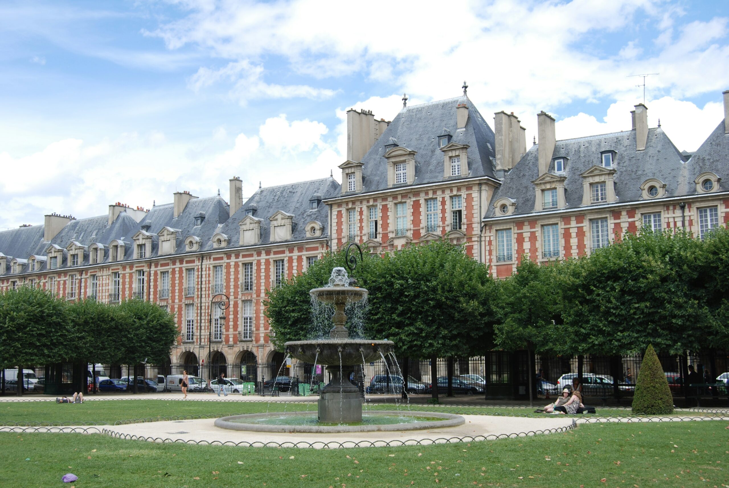 Place des Vosges Paris red brick square and garden view in Le Marais