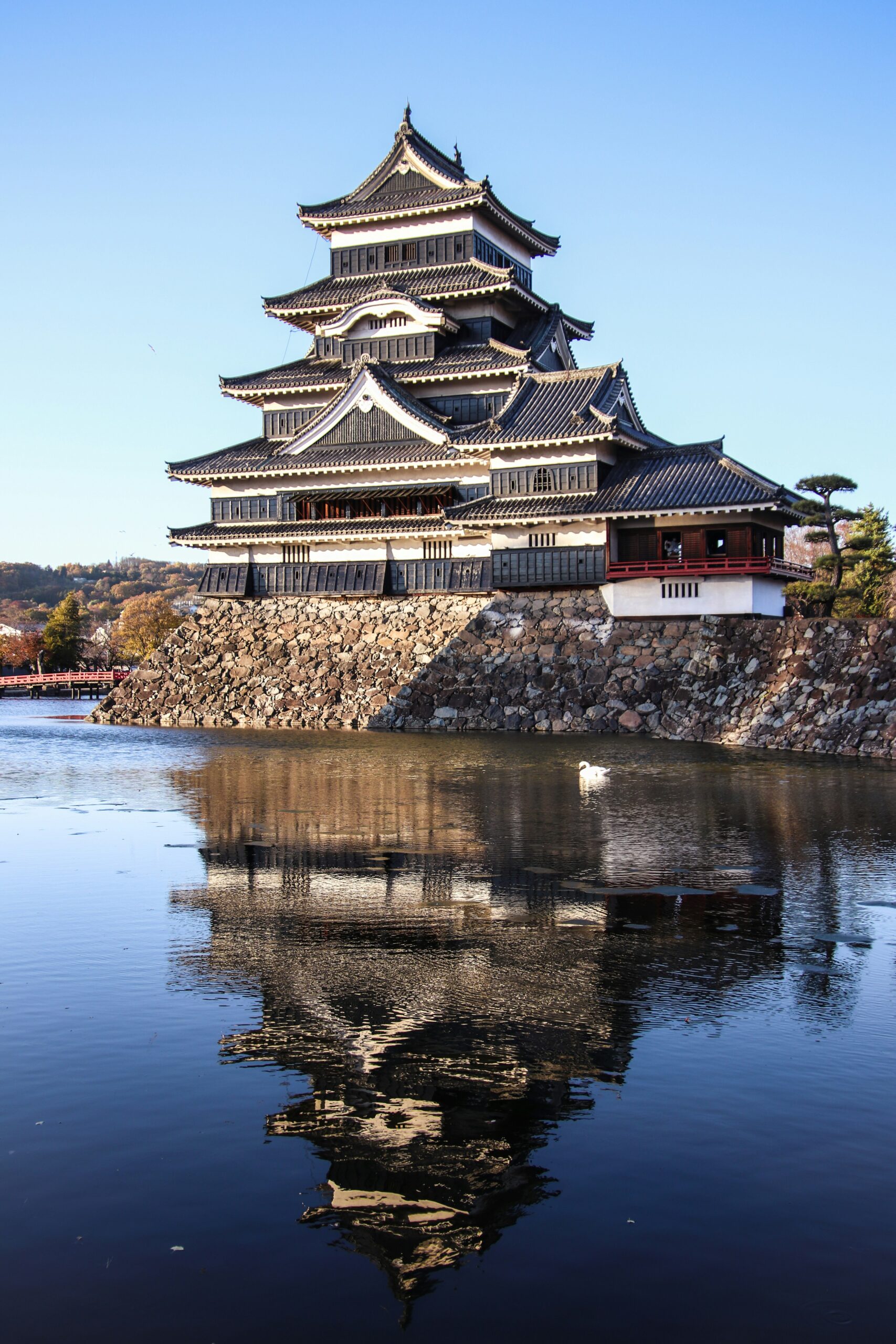 Matsumoto Castle (Crow Castle) Reflection View Matsumoto Castle reflected in the moat on a clear day in Matsumoto, Nagano, Japan