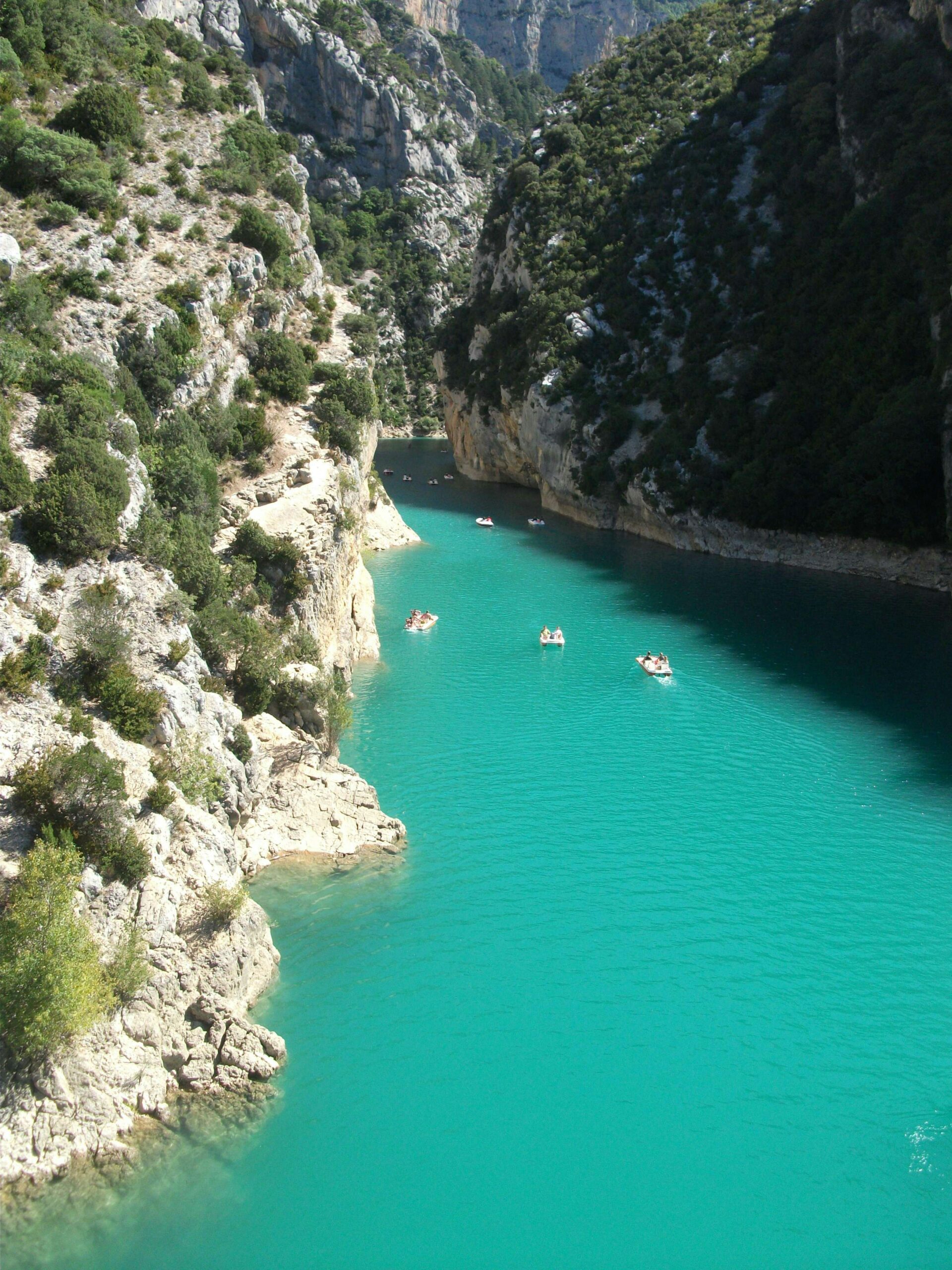 Gorges du Verdon turquoise river canyon view with boats in Provence France