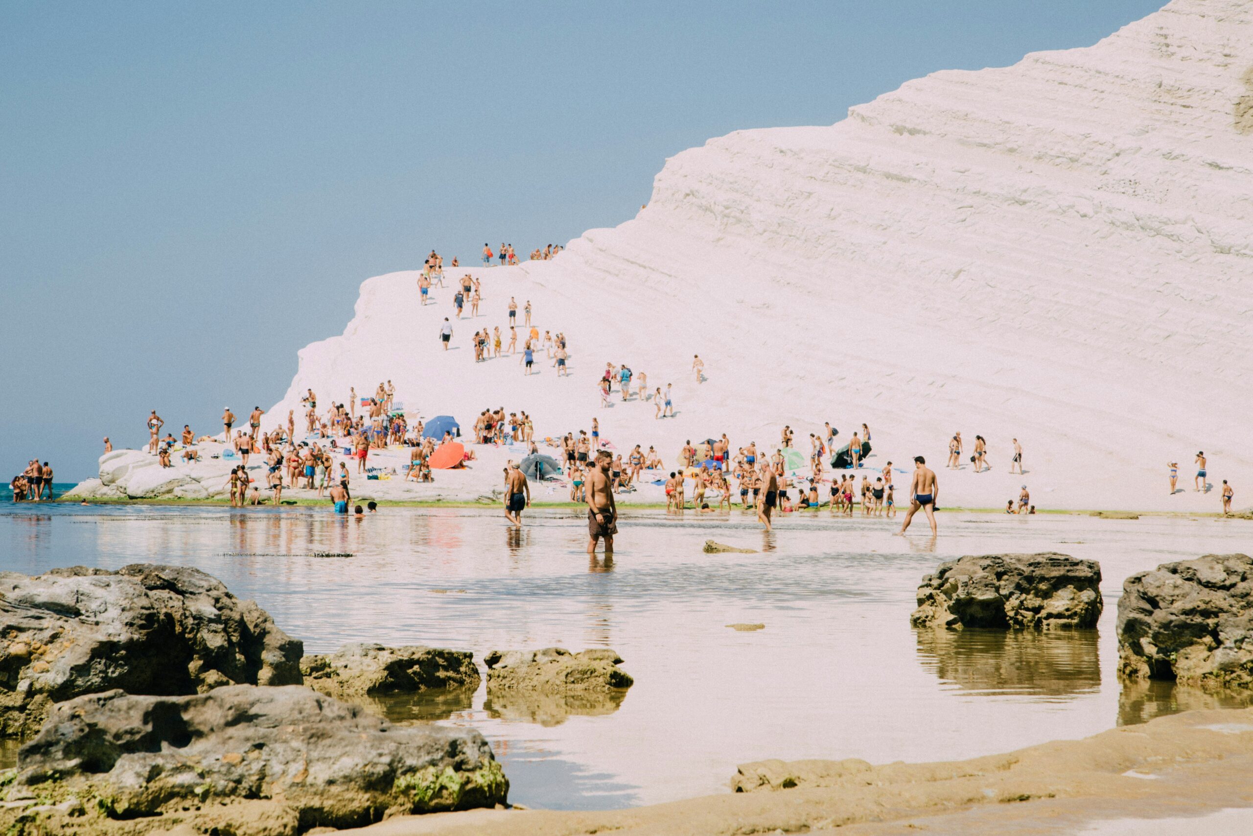 Scala dei Turchi Sicily white marlstone cliff with visitors on the terraces