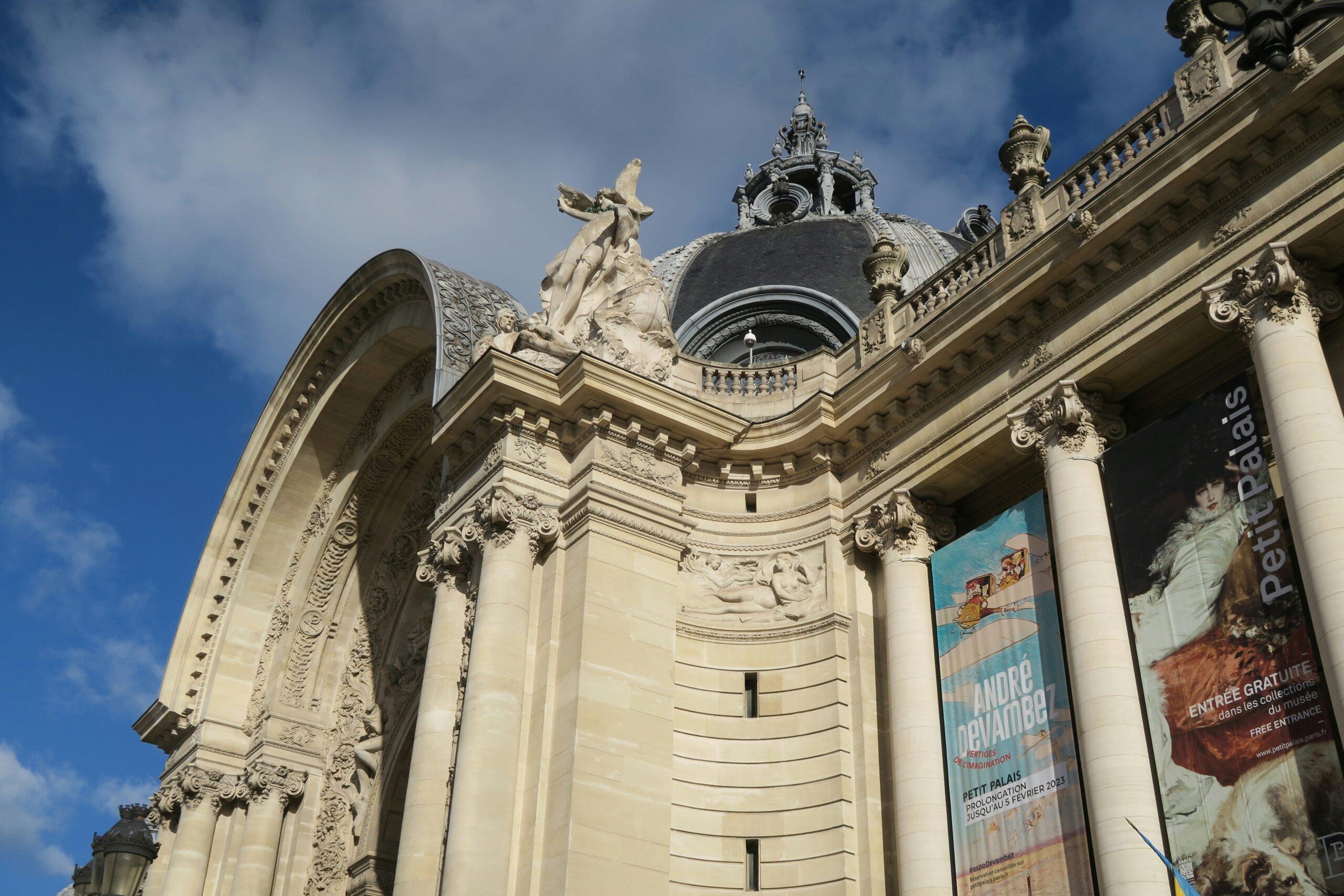 Petit Palais Paris exterior facade with Beaux-Arts columns and dome under blue sky