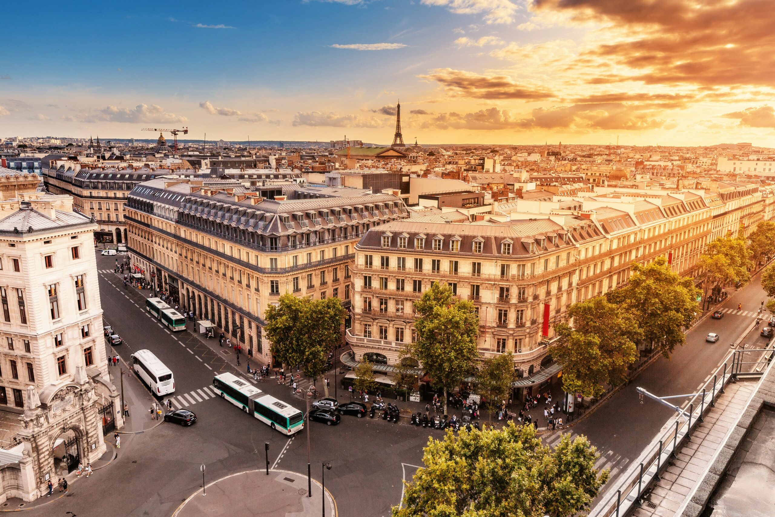 Golden-hour view of Place Vendôme area in Paris with classic Haussmann buildings and warm sunset light