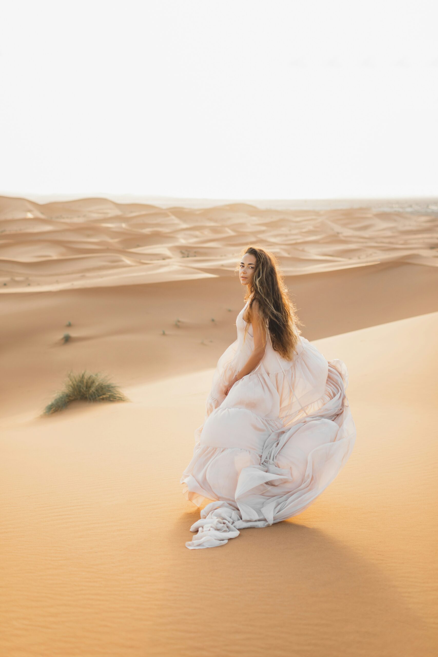 Oman desert dunes Wahiba Sands traveler walking in sand travel experience