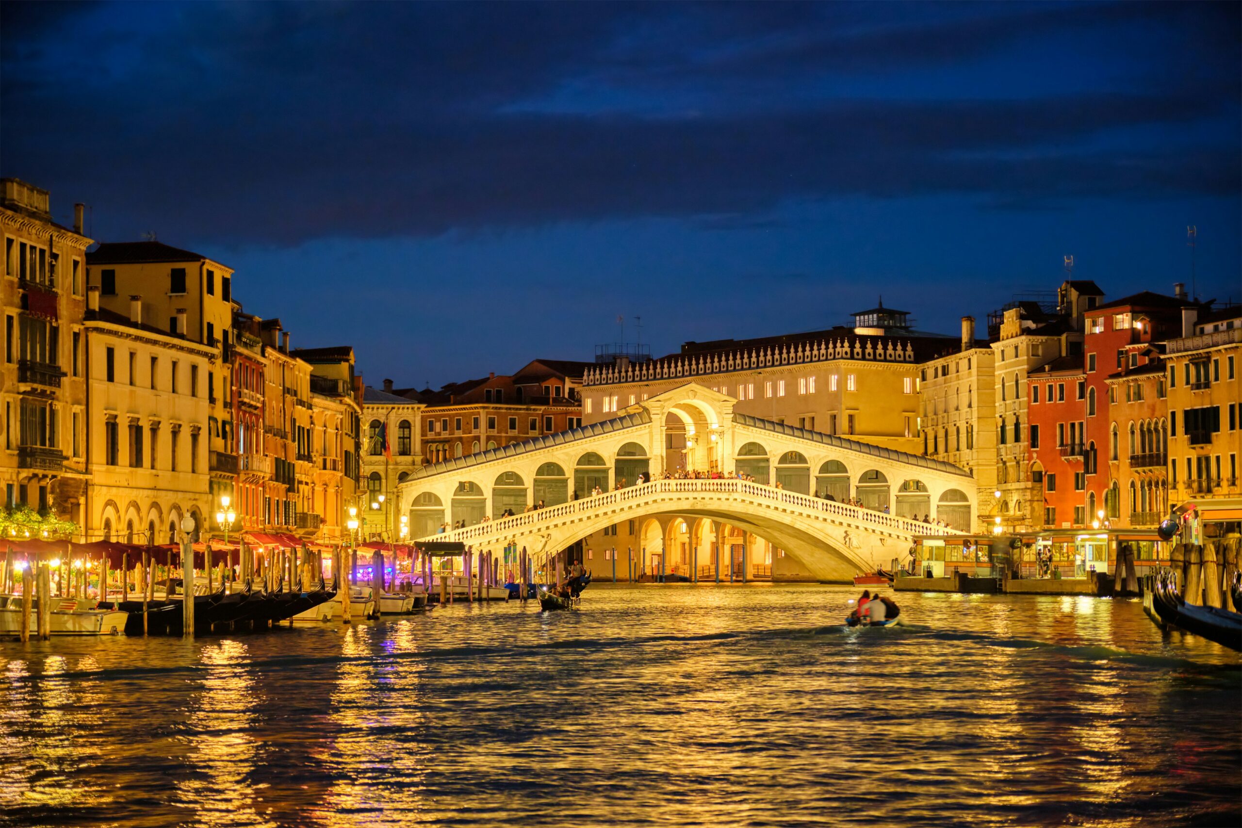 Rialto Bridge Venice at night Grand Canal illuminated historic bridge Italy