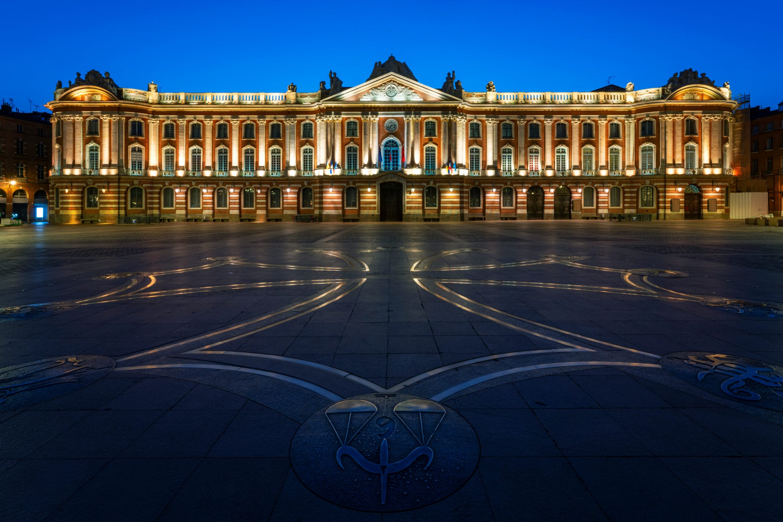 Place du Capitole Toulouse at night with illuminated Capitole building