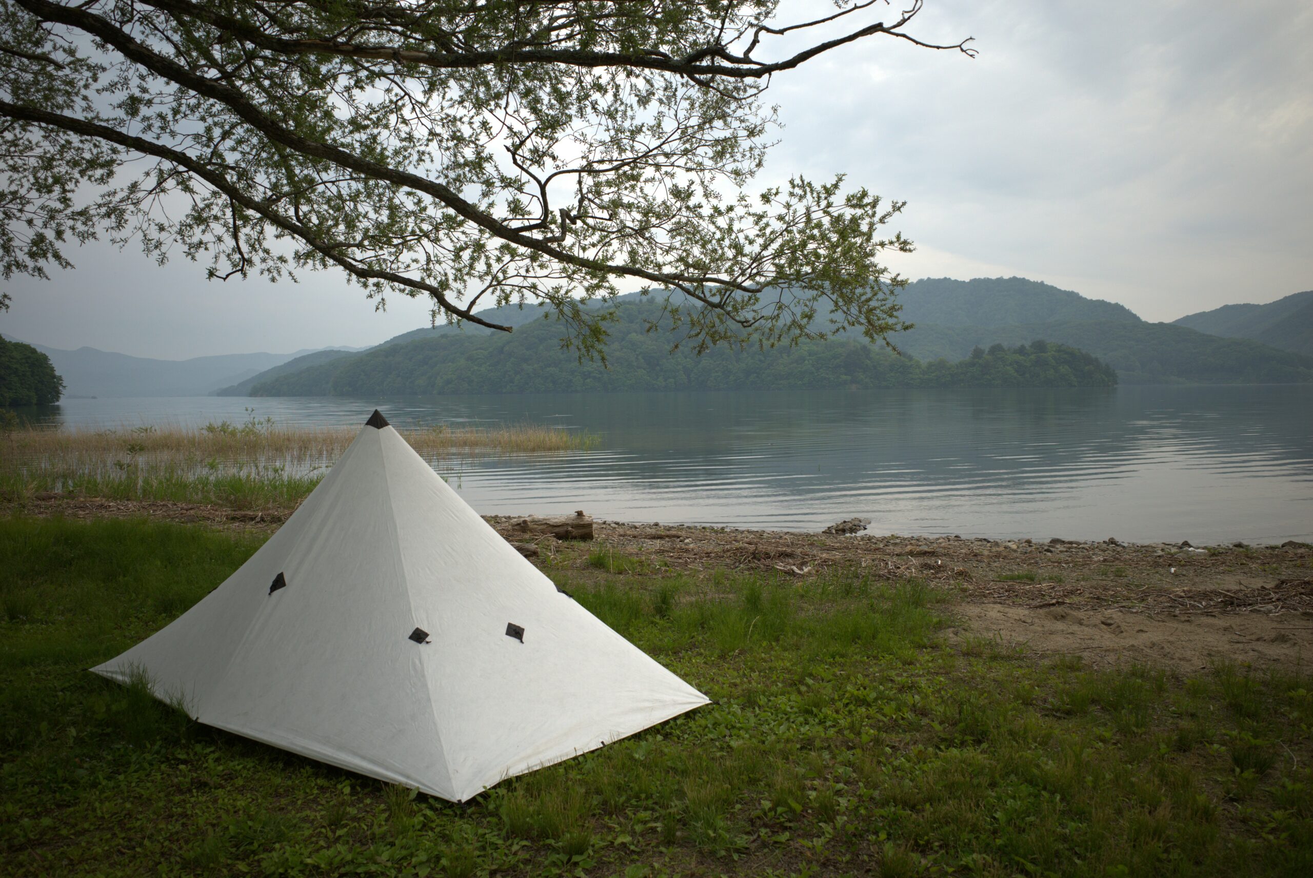 Misty lakeshore camping scene at Lake Inawashiro in Fukushima, Japan