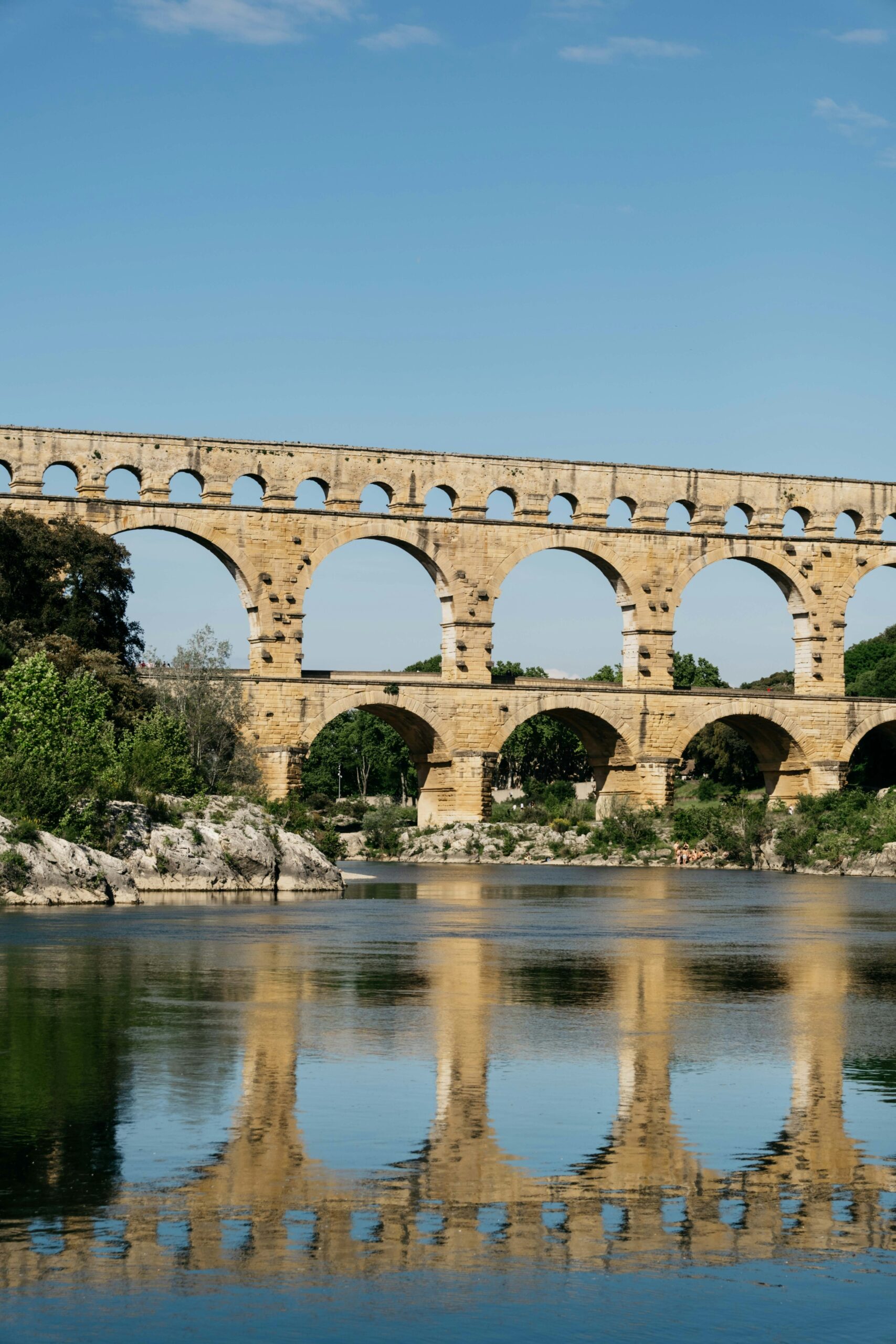 Pont du Gard Roman aqueduct bridge arches reflected in the Gardon River France UNESCO site