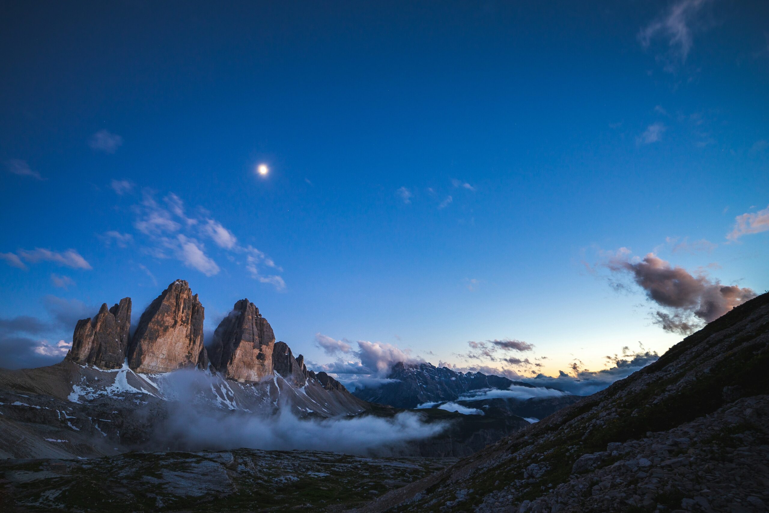 Dolomites Tre Cime di Lavaredo sunrise panorama with dramatic alpine peaks and clouds in the Italian Alps