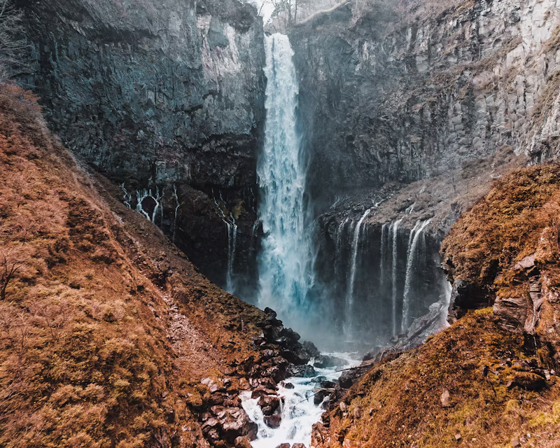 Kegon Falls Nikko waterfall in Nikko National Park surrounded by autumn cliffs Japan