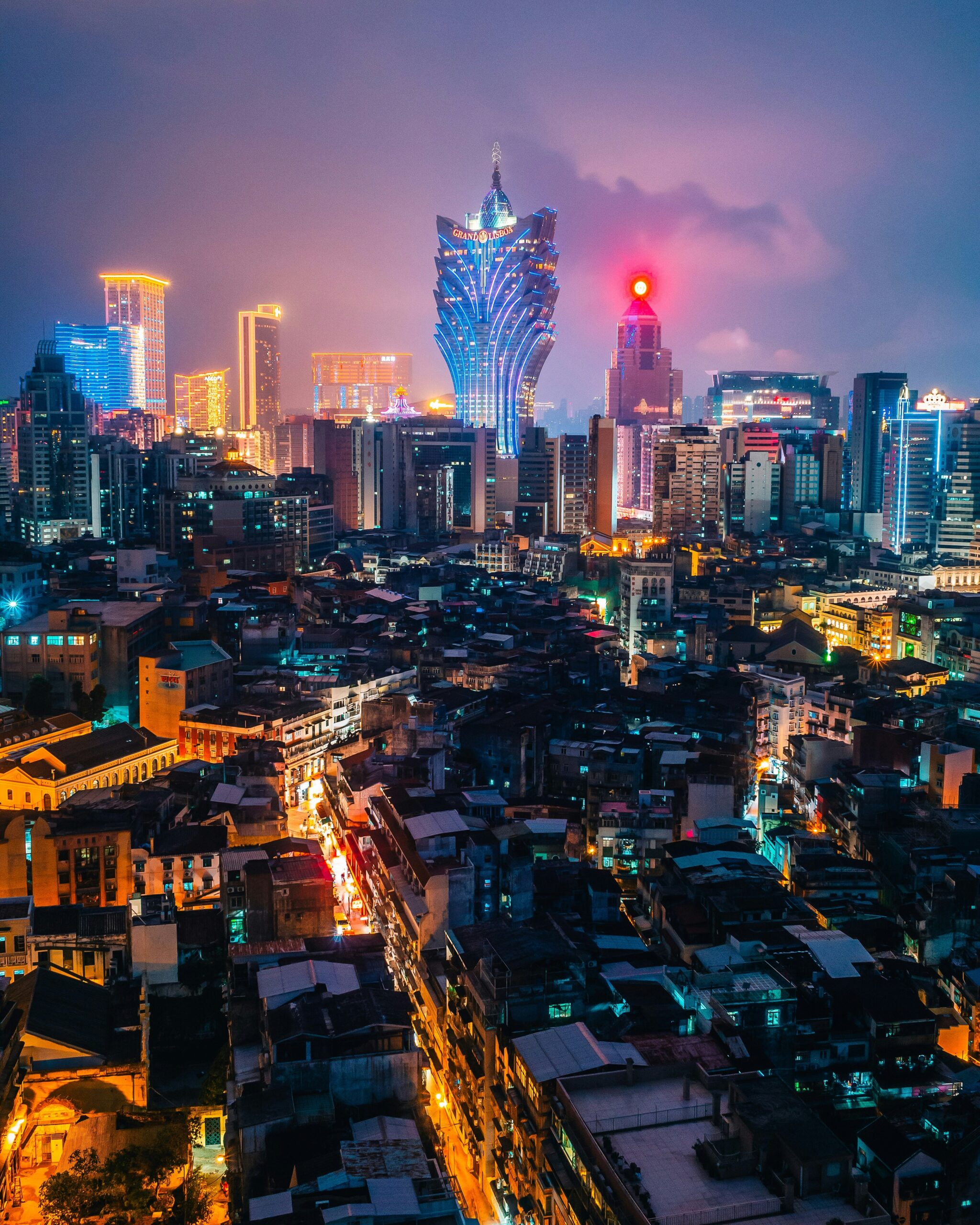 Macau skyline at night with casinos and city lights, travel and visa guide concept