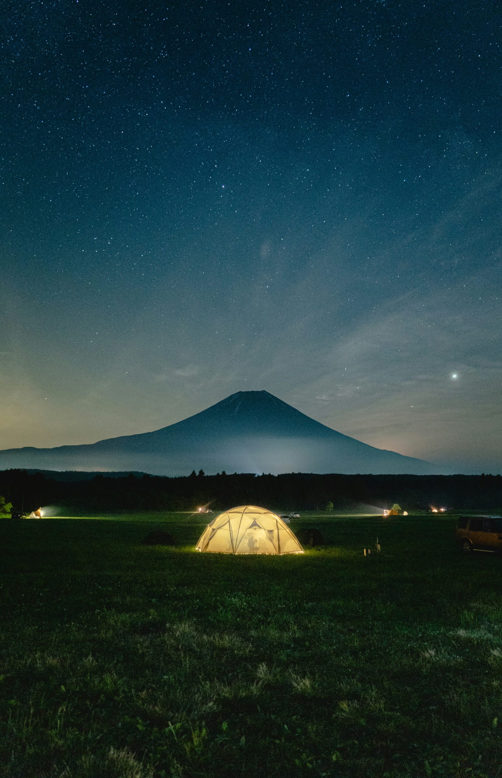 Mount Fuji night view with camping tent under the starry sky in Japan