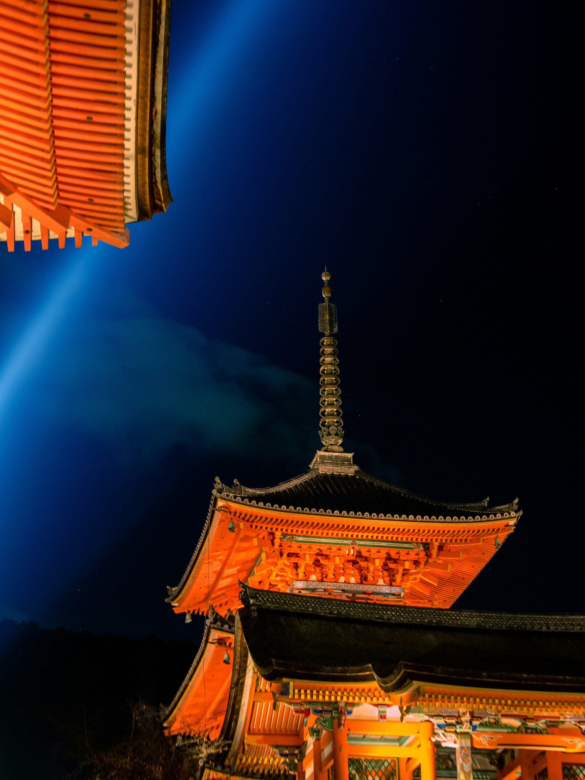 Kiyomizu-dera Temple illuminated at night in Kyoto with traditional pagoda and wooden architecture