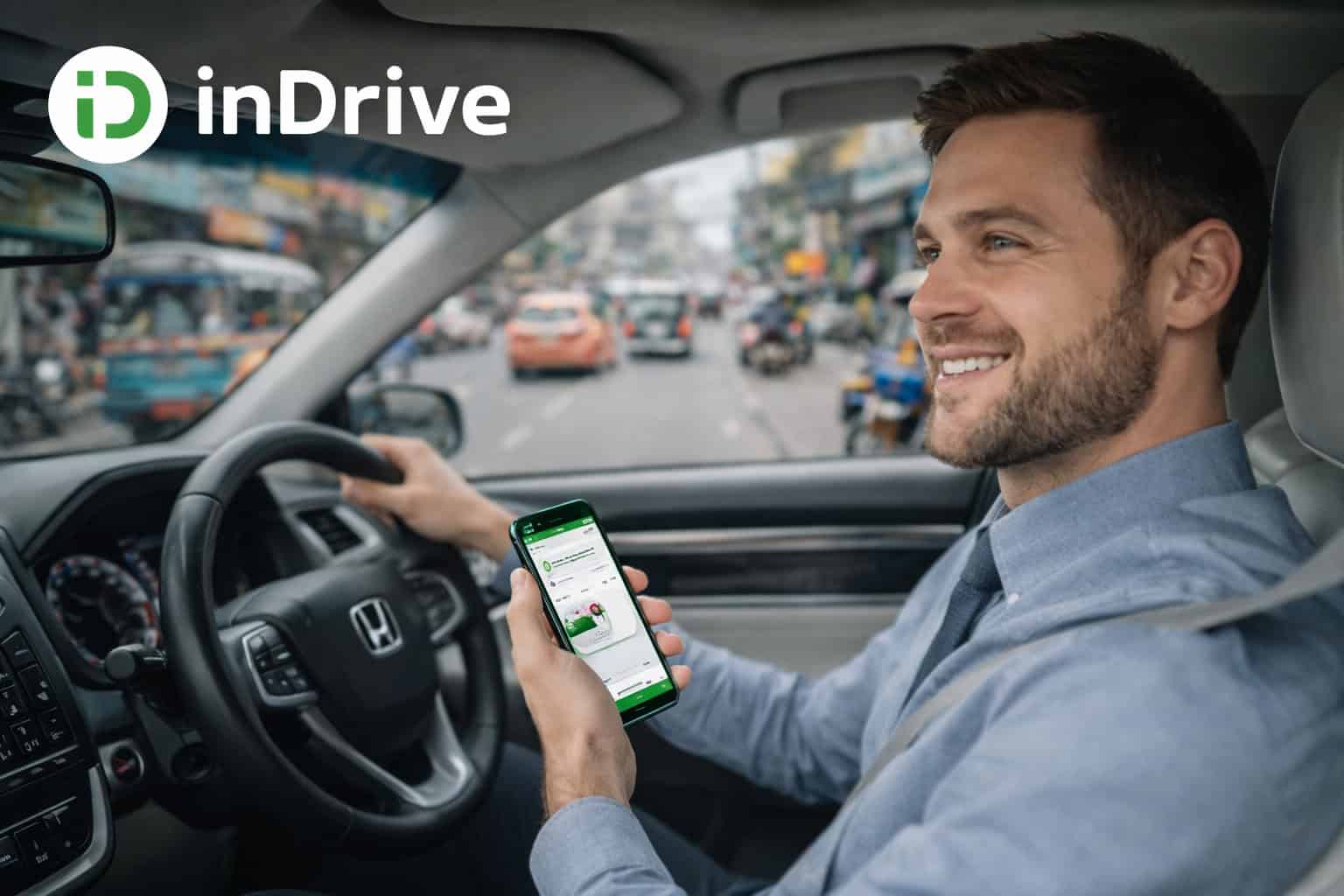 Smiling driver using inDrive ride-hailing app on smartphone while driving in city traffic