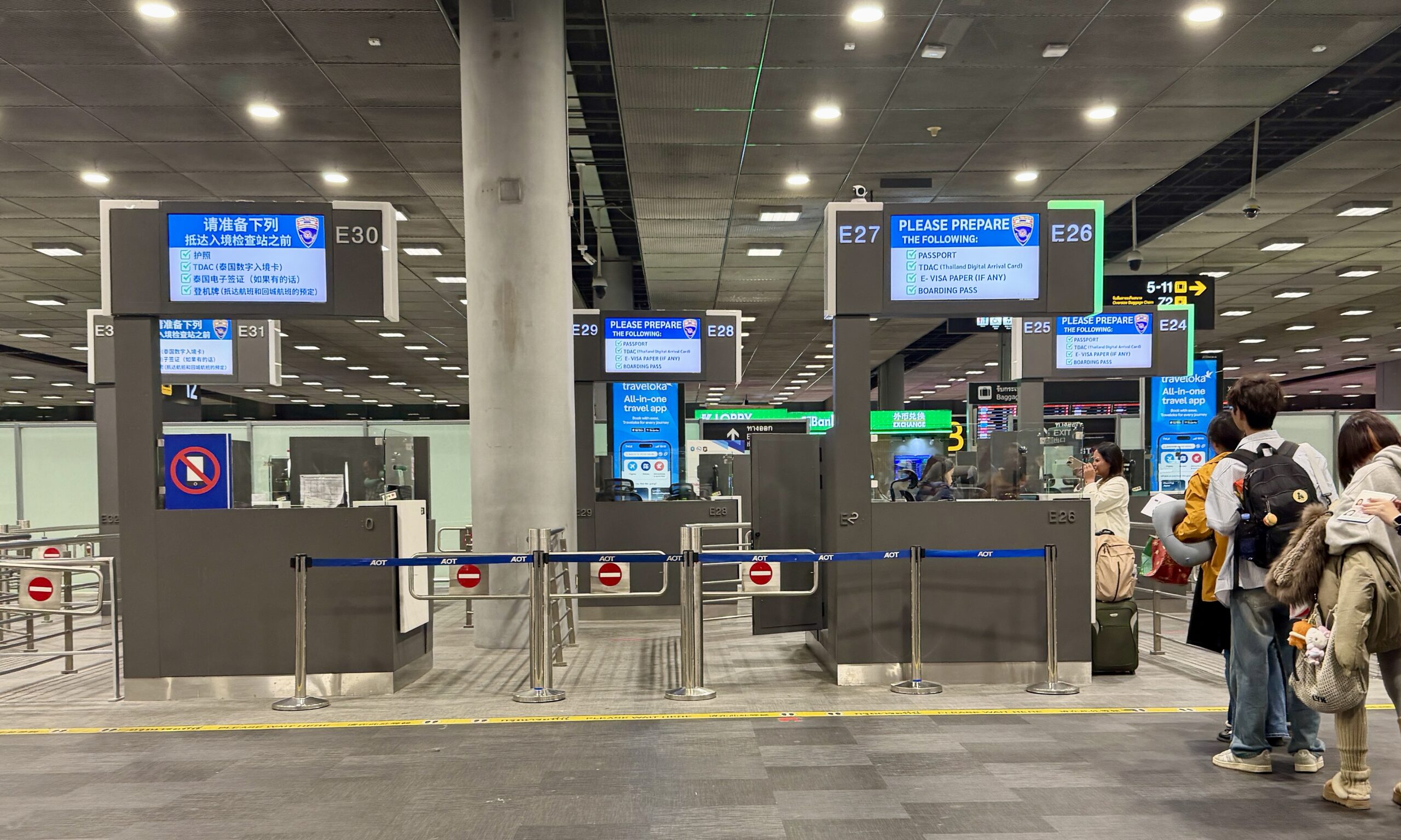 Bangkok airport arrivals corridor leading to immigration.